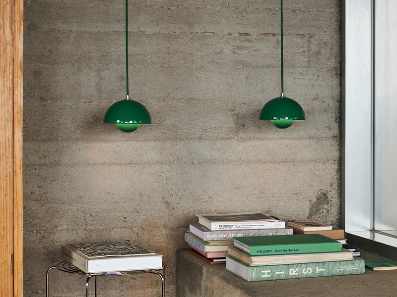 A pair of VP10 Flowerpot Pendant in signal green. The lights were designed by Verner Panton for &Tradition.