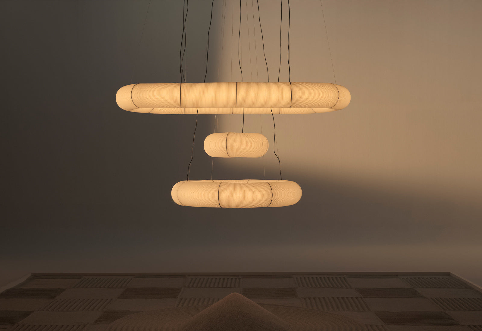 All the three sizes of the Tekio Circular pendant light by Anthony Dickens for Santa & Cole.