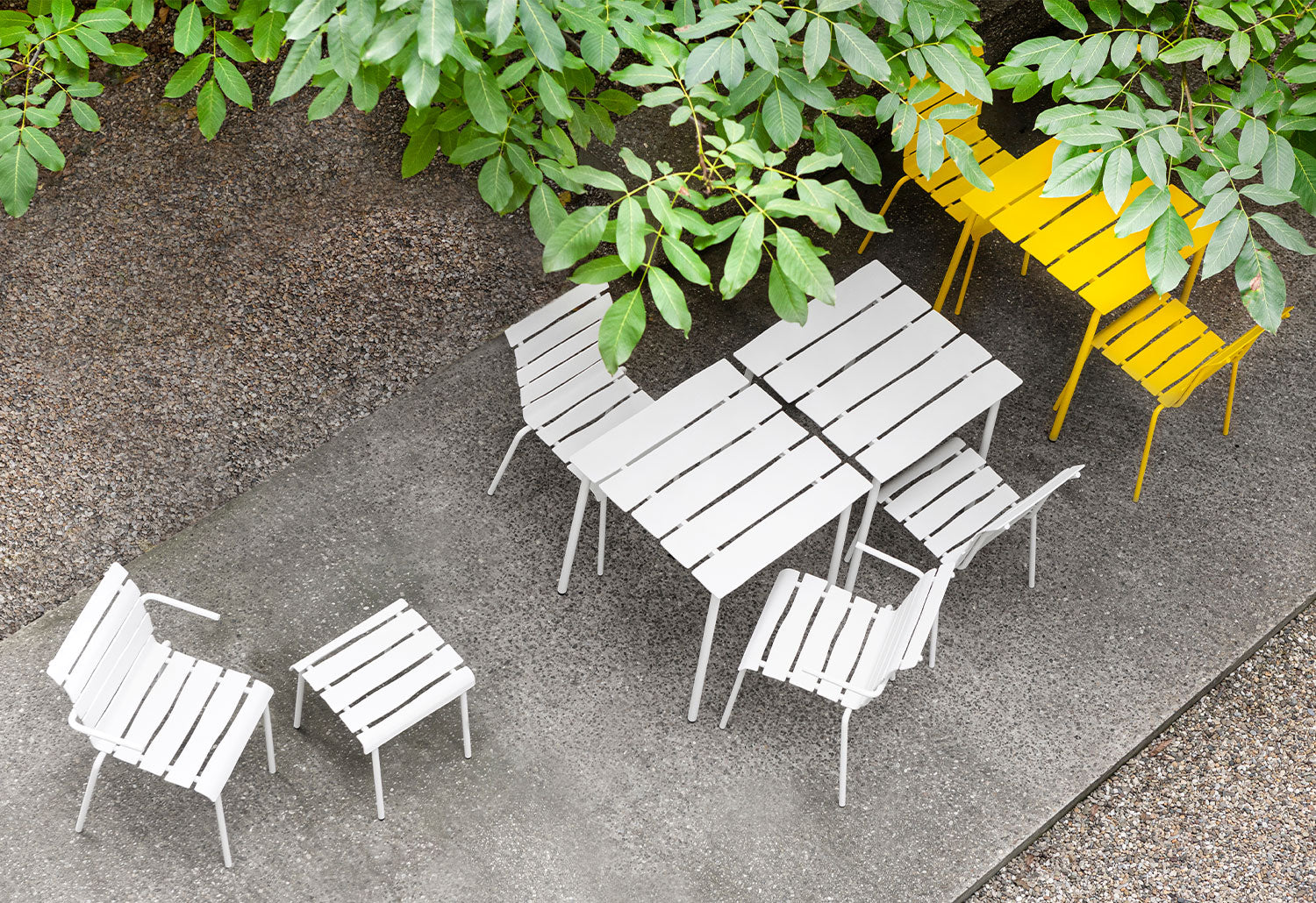 Three Square Aligned Tables by Maarten Baas for Valerie Objects with chairs, in off white and yellow, top view in outdoor space.