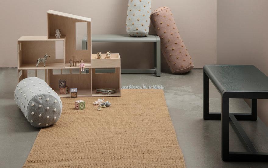  A childs play room featuring two Little Architect Benches in grey and dark green.