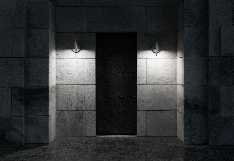 Two Captain Flint Wall lights on either side of a large door.