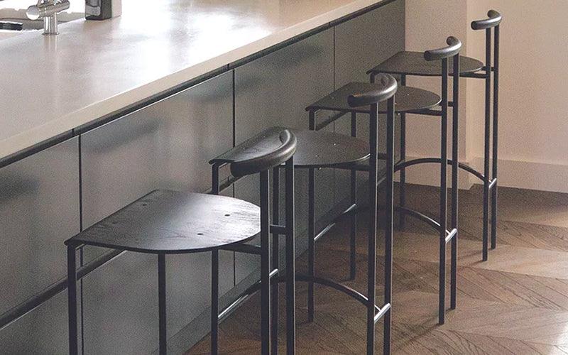  A set of four Tokyo barstools in an interior setting. Designed by Rodney Kinsman for OMK 1965.