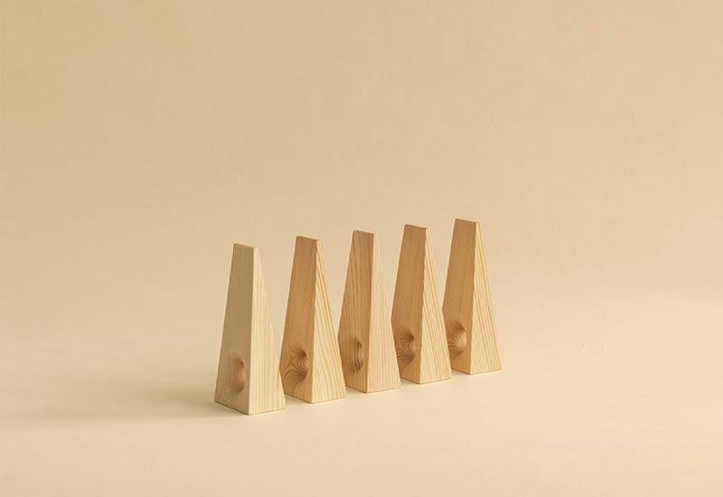A row of five 011 Doorstops by Vaarnii.