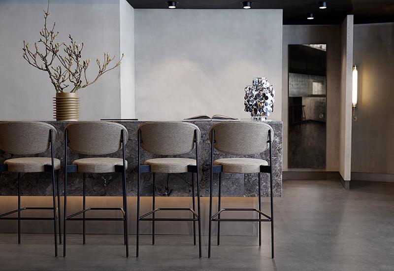 A row of four Series 430 bar stools designed by Verner Panton for Verpan.