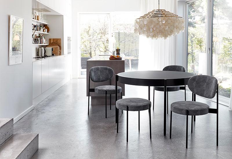 The Series 430 table by Verner Panton for Verpan with chairs and a stool from the same range.