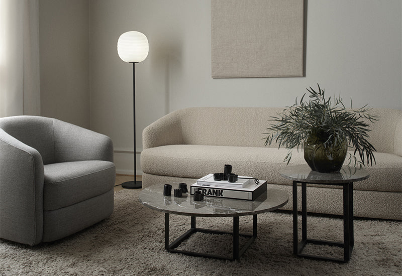 New Works Lantern floor lamp in a living room next to a sofa