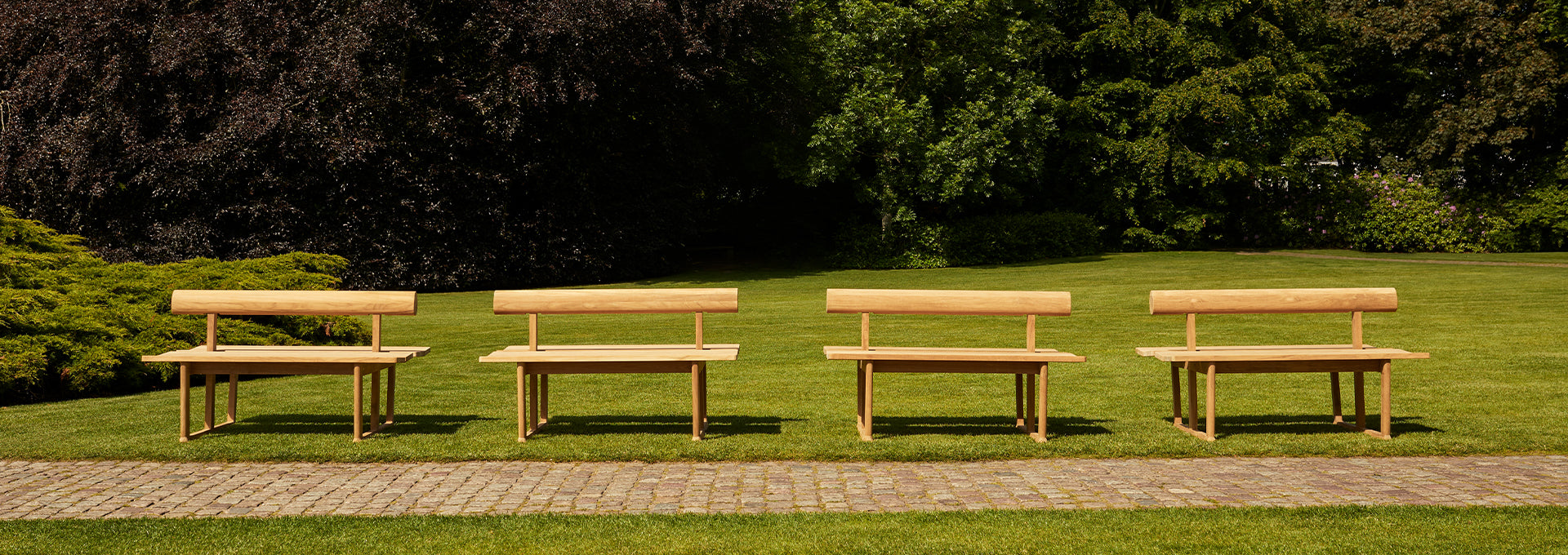 Fritz Hansen Banco bench by Hugo Passos used for public seating in a park