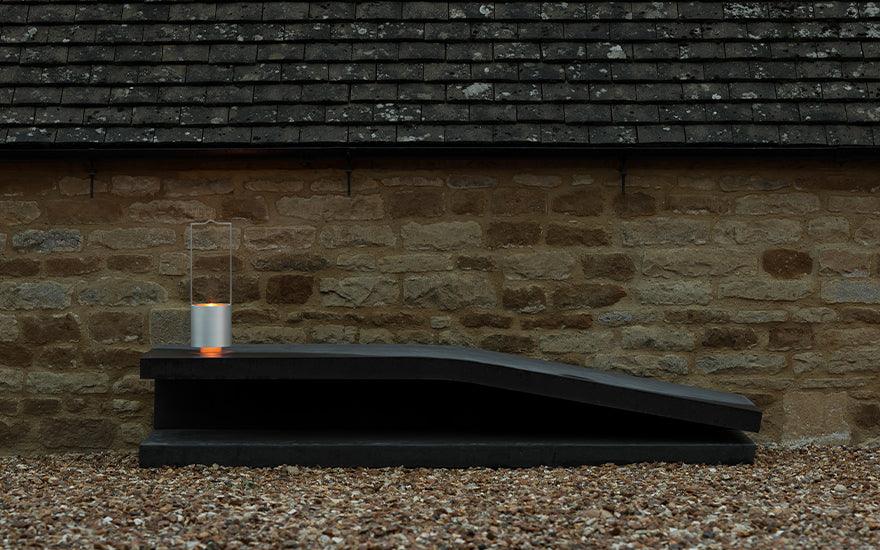  Wastberg Holocene 4 on a black stone bench