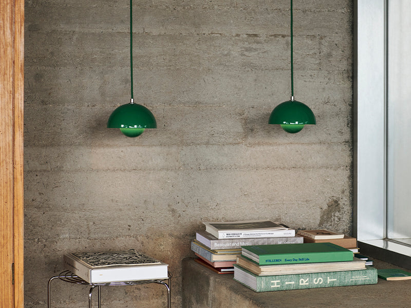  A pair of VP10 Flowerpot Pendant in signal green. The lights were designed by Verner Panton for &Tradition.