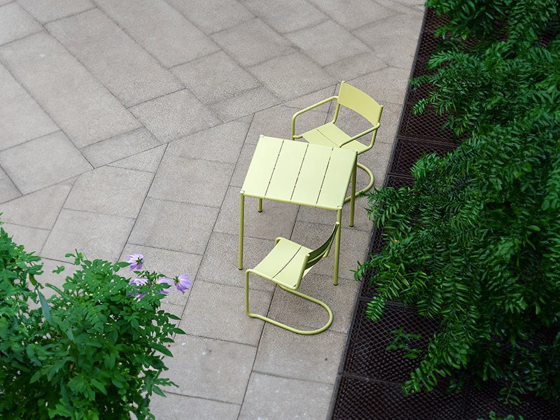  The Sine dining armchair, chair and small table in yellow.