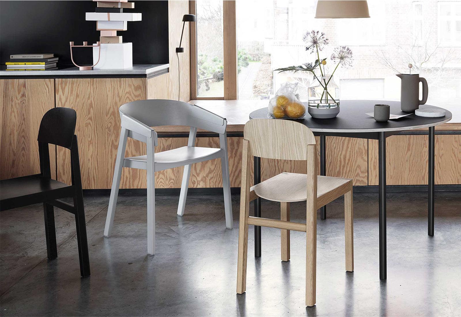  The Workshop chair by Cecilie Manz for Muuto at a round table.